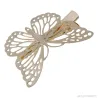 Haarspange mit goldenem Schmetterling