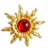 Vintage Ohrringe in Sonnen- / Sonnenblumenform - mit roter Perle