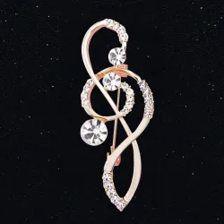 Luxuriöse Goldbrosche - mit Kristallmusiknote