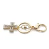 Keyring with a crystal crossKeyrings
