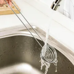 Eiweißtrenner - spiralförmiger Edelstahllöffel - langer Griff
