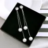 Elegante lange Ohrringe mit Perlen / Kristall