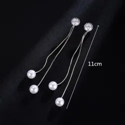 Elegante lange Ohrringe mit Perlen / Kristall