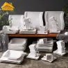 Elegantes Geschirr - Tafelservice aus weißem Porzellan - Tassen - Untertassen - Teller