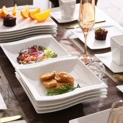 Elegant tableware - white porcelain dinner set - cups - saucers - platesCutlery