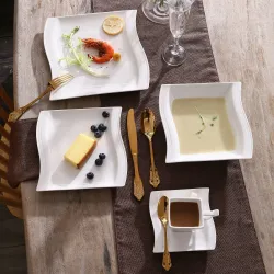 Elegantes Geschirr - Tafelservice aus weißem Porzellan - Tassen - Untertassen - Teller