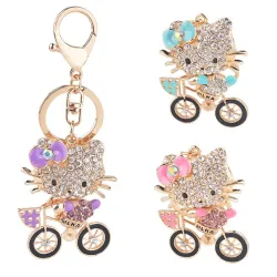 Kristallkätzchen auf einem Fahrrad - keychain