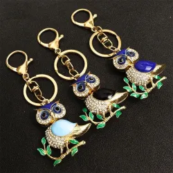 Golden crystal owl - green leaves - keychainKeyrings