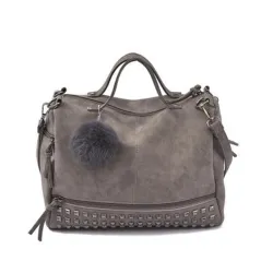 Vintage Tasche aus Nubukleder mit Nieten / Fellbommel