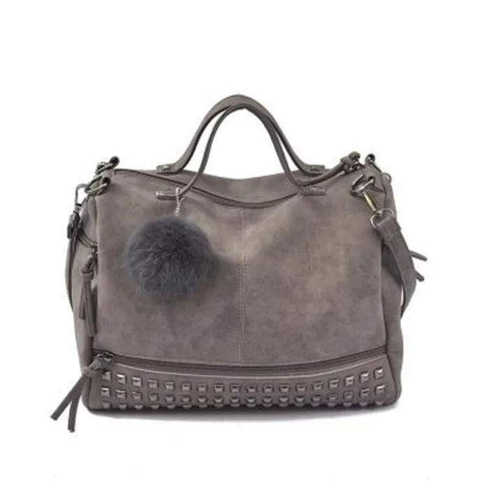 Vintage Tasche aus Nubukleder mit Nieten / Fellbommel