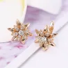 Goldene Blumenohrringe mit Kristallen