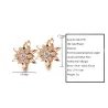 Goldene Blumenohrringe mit Kristallen