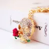 Golden crystal skull with rose - keychainKeyrings