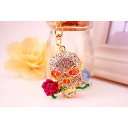 Golden crystal skull with rose - keychainKeyrings