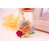 Golden crystal skull with rose - keychainKeyrings