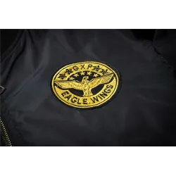Black bomber jacket with embroidered golden wingsJackets