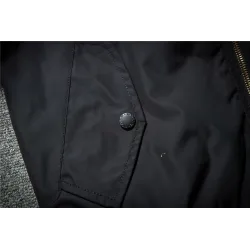 Black bomber jacket with embroidered golden wingsJackets